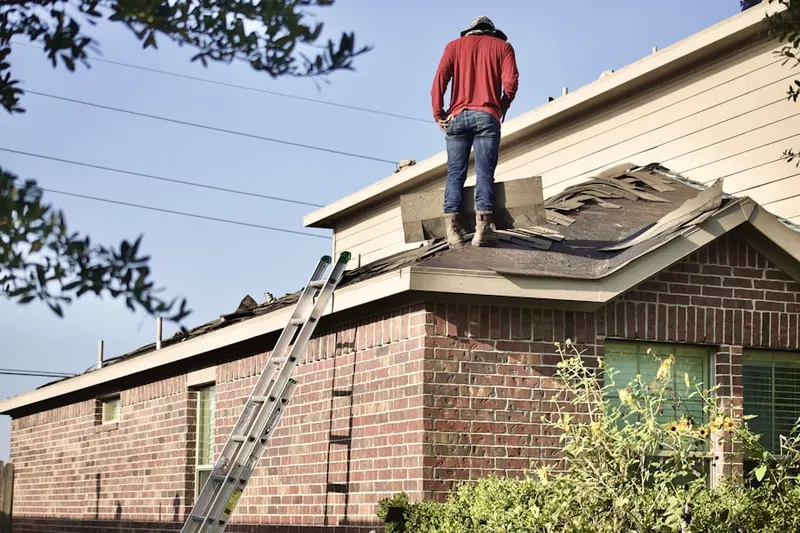 Professional roofer working on a residential roof in Pecan Acres